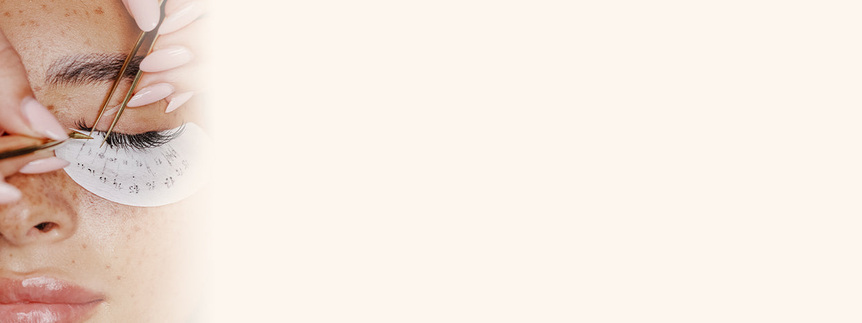 Lash Technician isolating individual lashes to apply new eyelash extensions