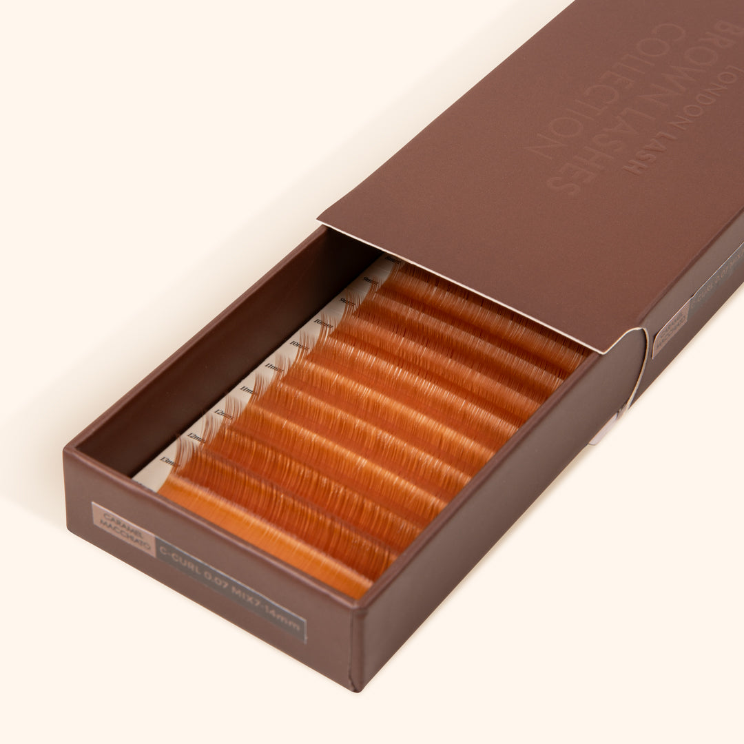 half open brown lash tray with ginger brown lash extensions inside