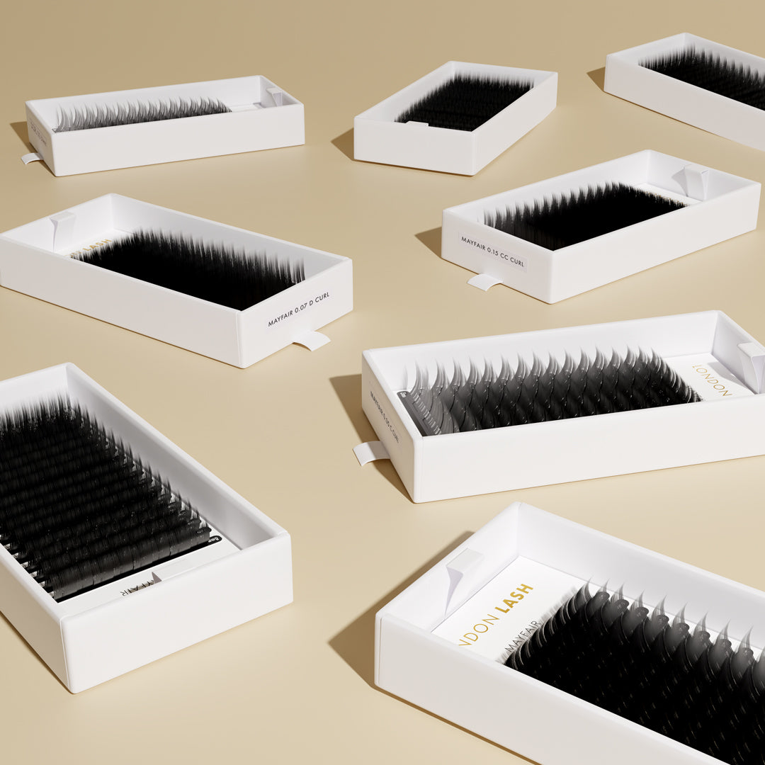 few open lash trays laying on the flat surface