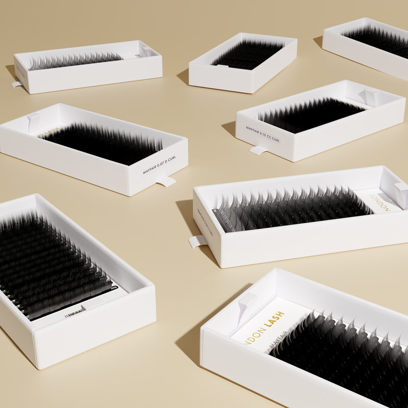 few open lash trays laying on the flat surface