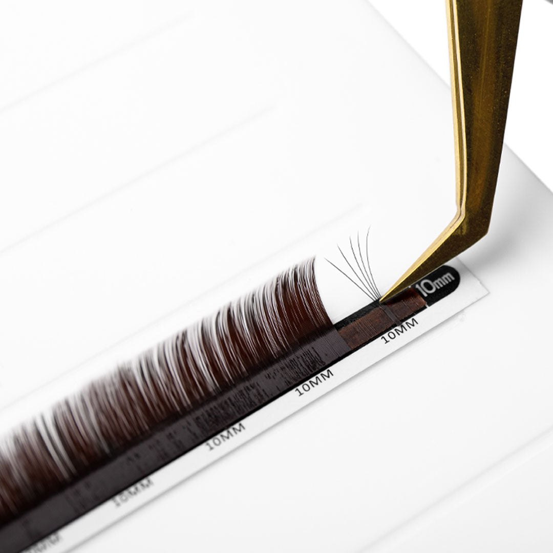 brown eyelash extensions in 0.07 being fanned with fine tip volume tweezers