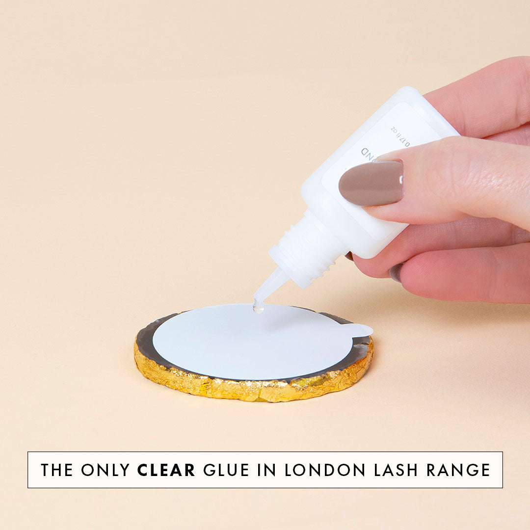 crystal bond clear lash extension glue being dispensed onto a jade stone